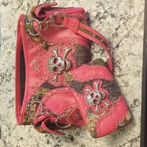 Concealed weapon rhinestone pink camo skull purse.